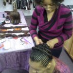 Khalilah braids as her daughter models